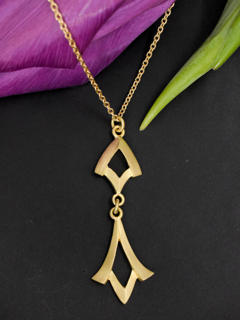 graceful gold pendant from Nikki Lorenz Designs