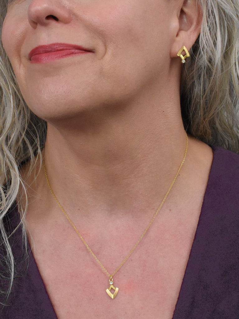 gold and diamond shield shaped earrings and pendant from Nikki Lorenz Designs