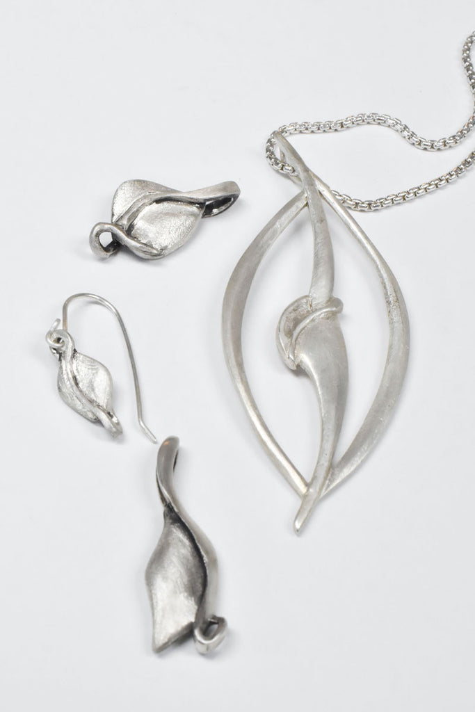 silver necklaces and silver earrings from Nikki Lorenz Designs