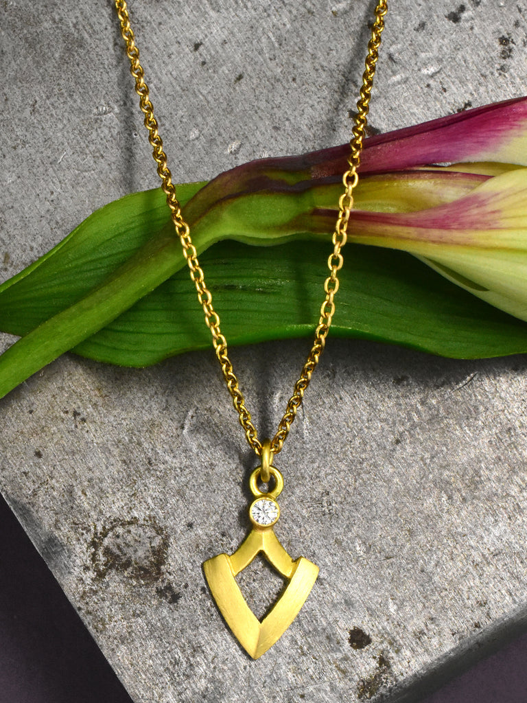 gold and diamond shield shaped pendant from Nikki Lorenz Designs