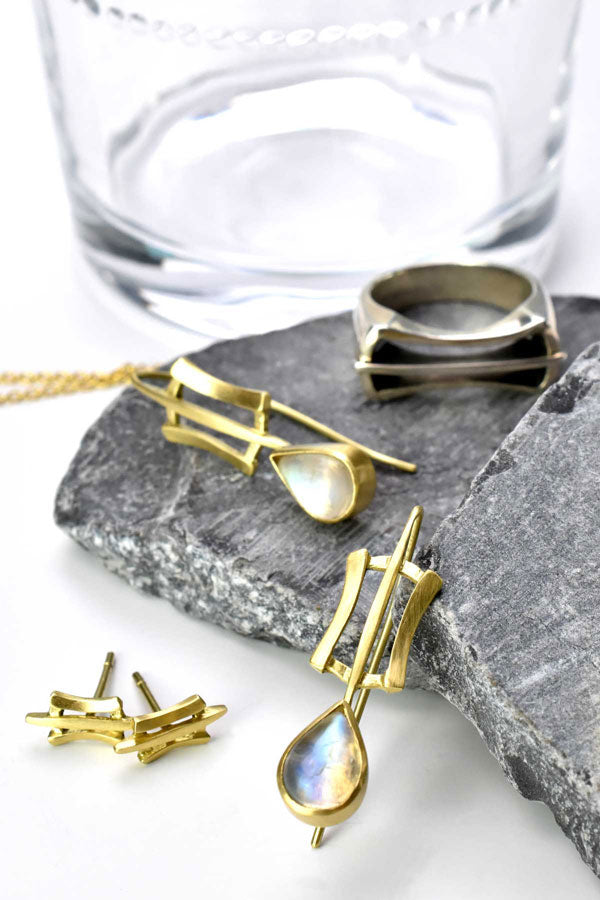 gold and moonstone earrings, gold stud earrings and silver ring from Nikki Lorenz Designs