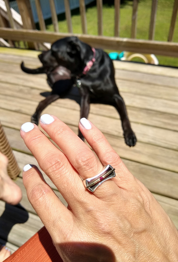 Relaxing on the deck with my dog and my silver hourglass ring