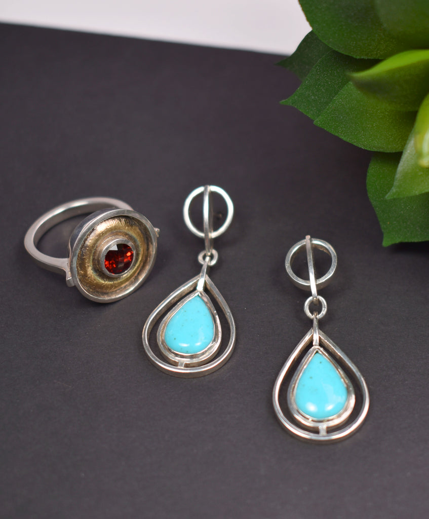 silver and gold garnet ring with silver and turquoise earrings