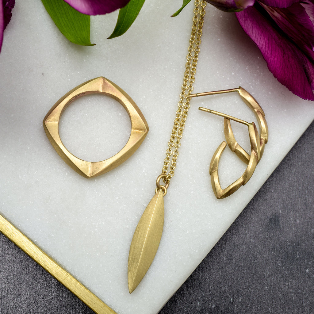 yellow gold hoop earrings with matching pendant and ring from Nikki Lorenz Designs