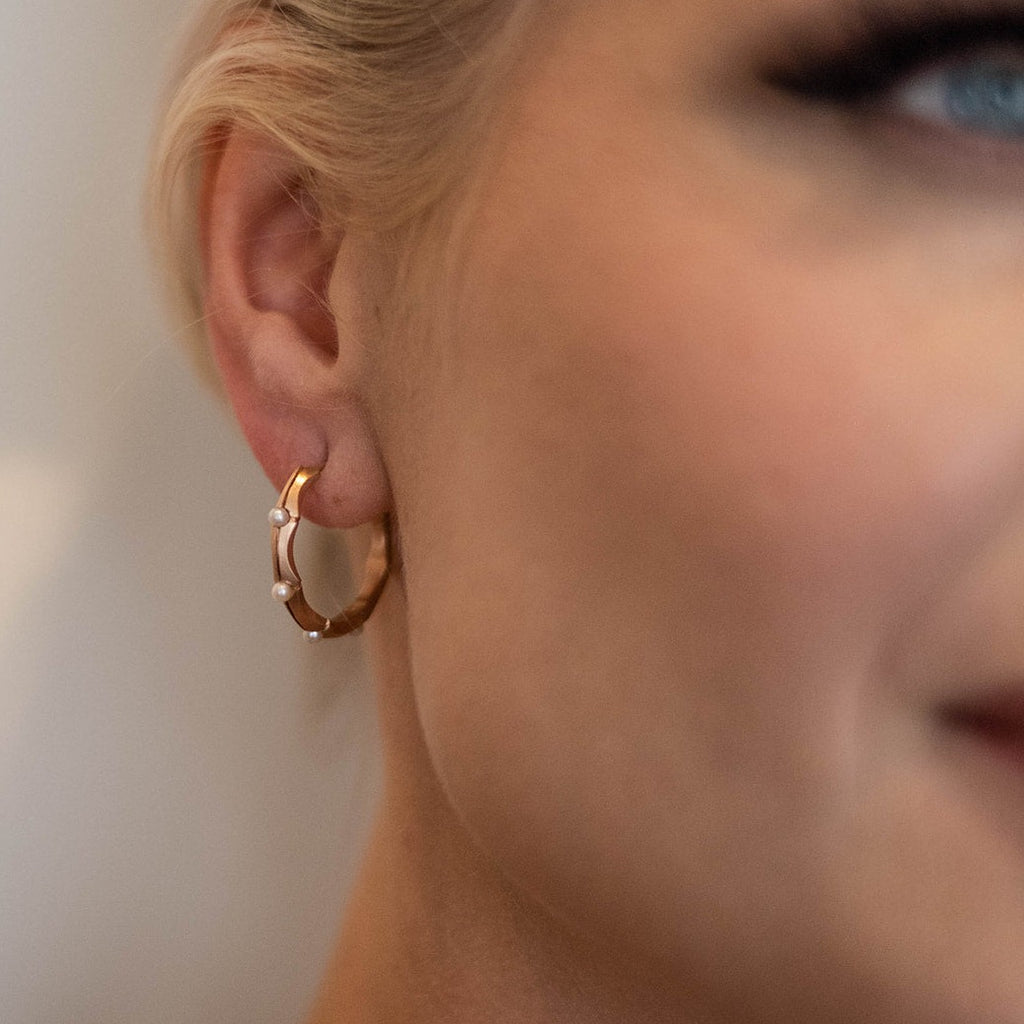 woman wearing pink gold and pearl hoop earrings from Nikki Lorenz Designs