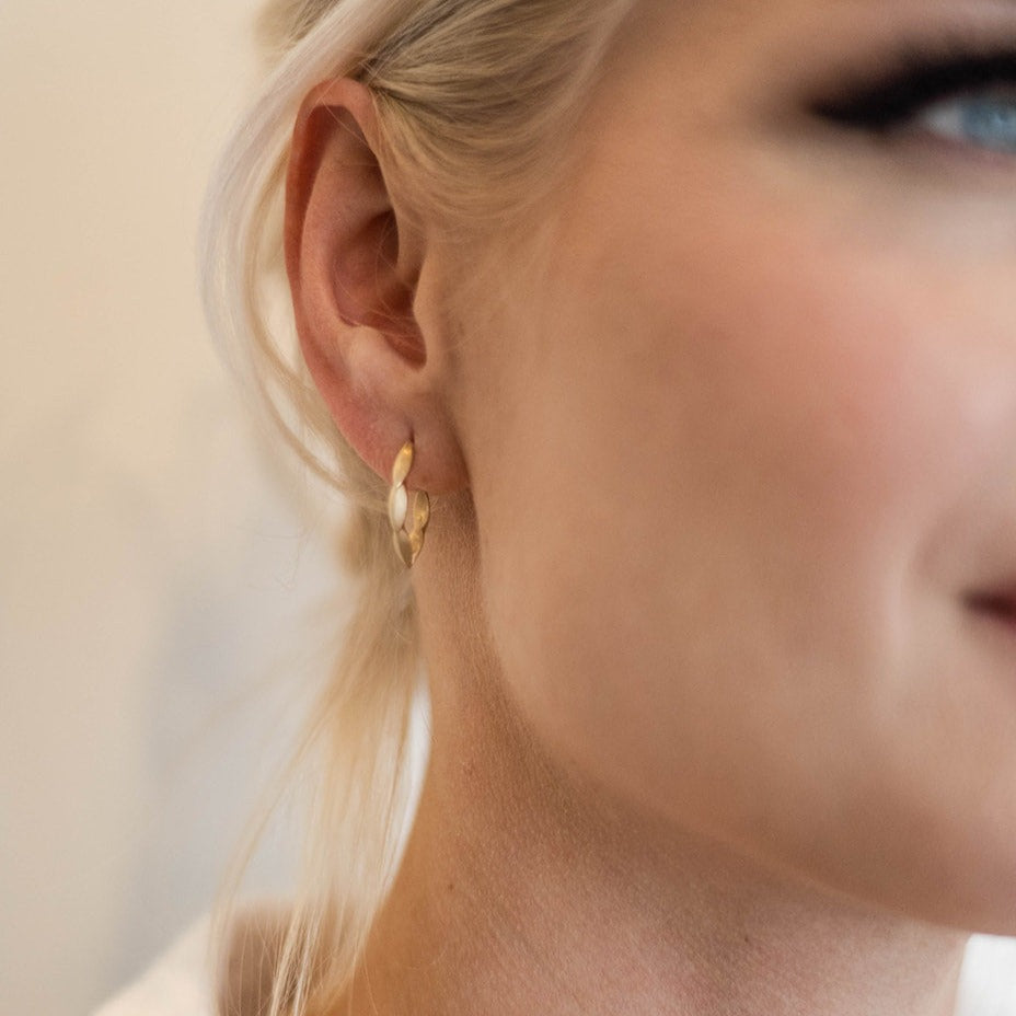woman wearing gold hoop earring from Nikki Lorenz Designs