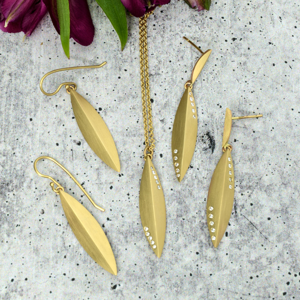 matching gold and diamond elongated pendants and earrings from Nikki Lorenz Designs