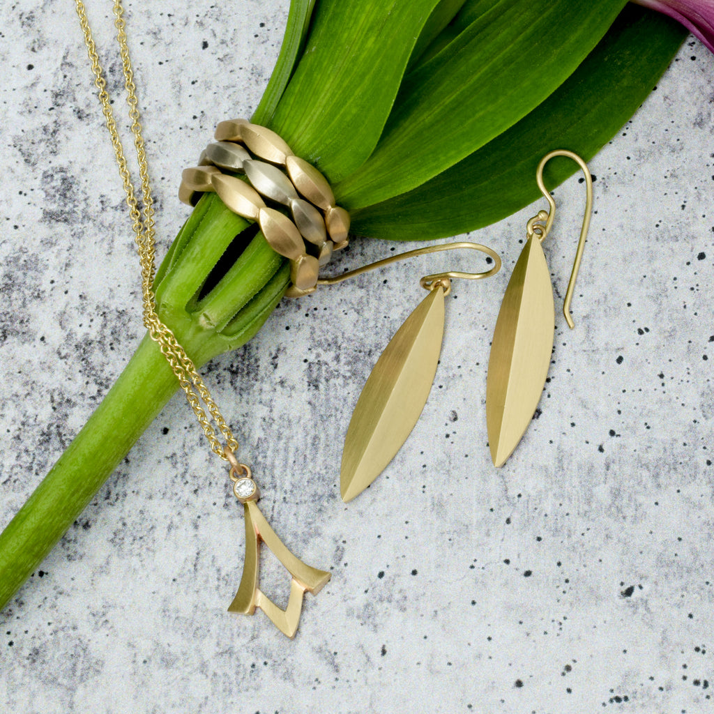 modern elongated gold and diamond jewelry from Nikki Lorenz Designs