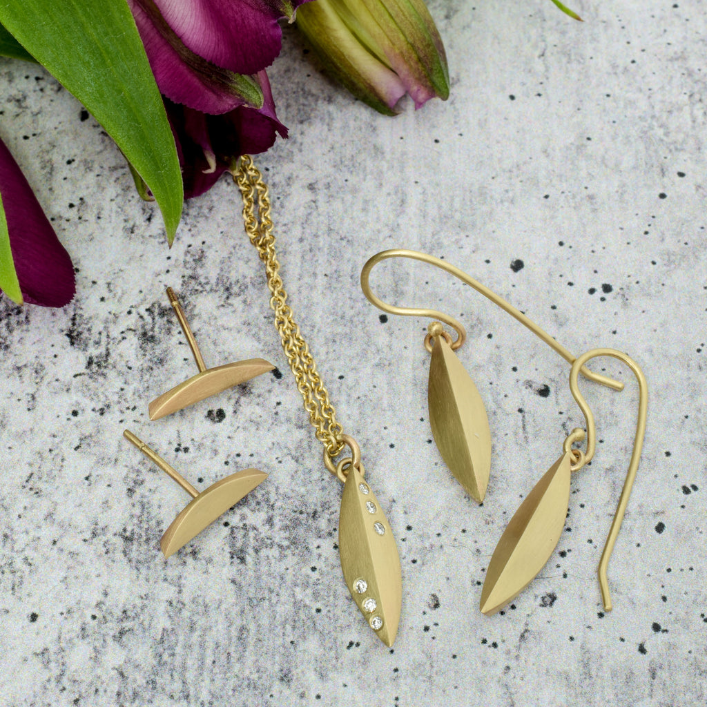 14k gold elongated stud and dangle earrings with small elongated gold and diamond pendant from Nikki Lorenz Designs